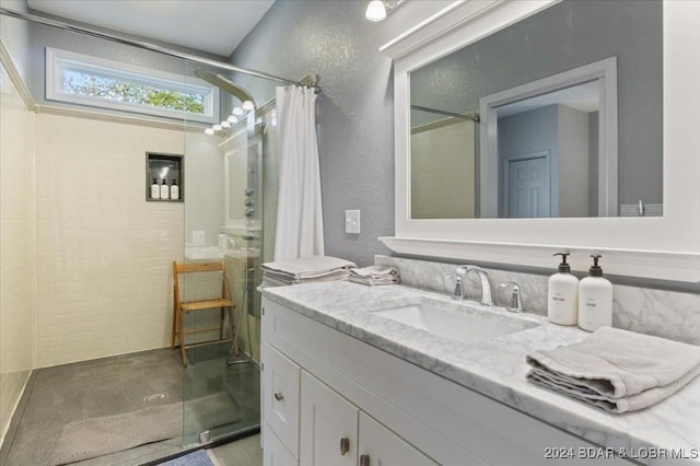 6334 Red Barn Rd, Osage Beach, MO 65065 - bathroom with a tile shower, vanity, concrete flooring, and a textured wall