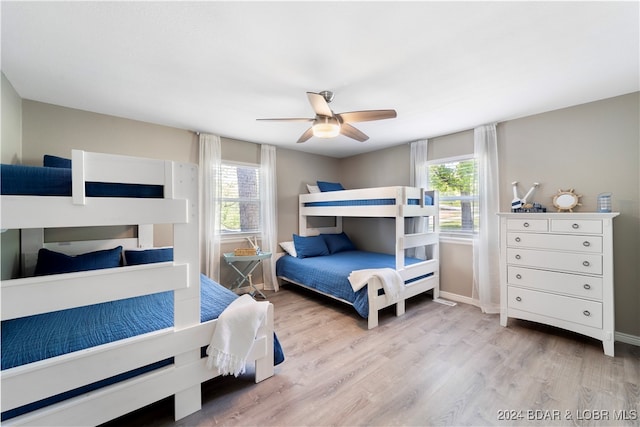 bedroom with light wood-type flooring and ceiling fan