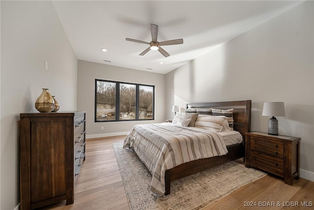 bedroom featuring light hardwood / wood-style flooring and ceiling fan