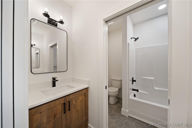 full bathroom featuring tile patterned flooring, vanity, toilet, and washtub / shower combination