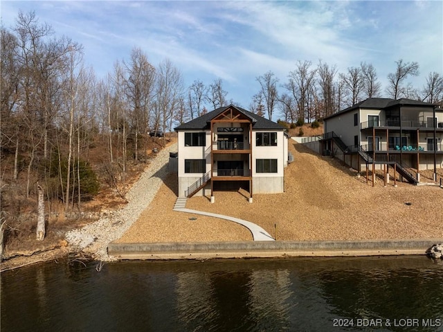 rear view of property featuring a water view