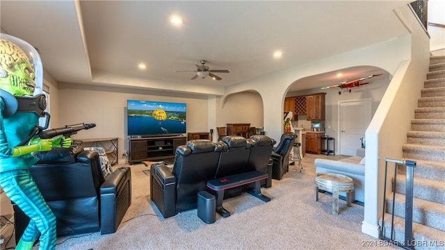 carpeted living room featuring ceiling fan