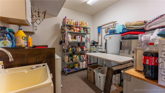 interior space featuring electric water heater and sink