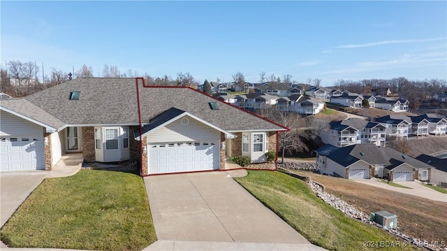 single story home with a garage and a front yard