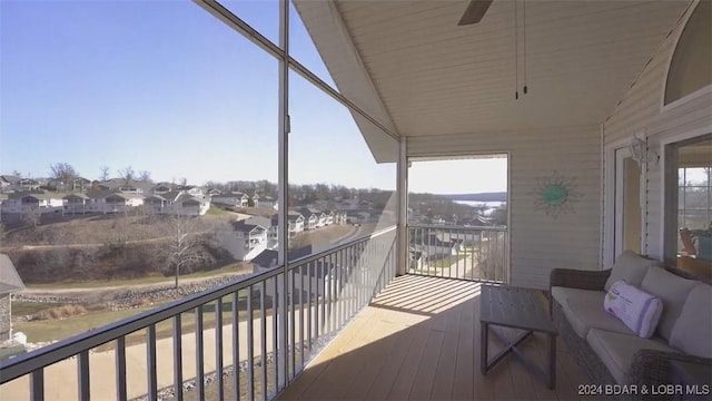 balcony featuring an outdoor living space and ceiling fan