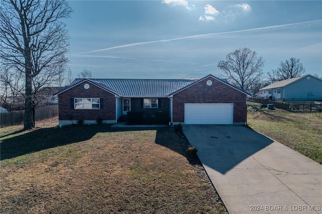 single story home with a garage and a front lawn