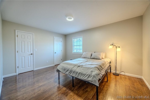 bedroom featuring dark hardwood / wood-style flooring