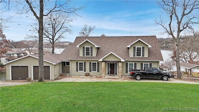 cape cod-style house with a front yard