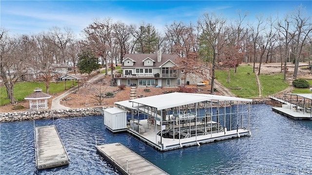 view of dock with a water view and a gazebo