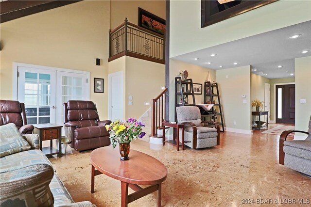 living room with a towering ceiling