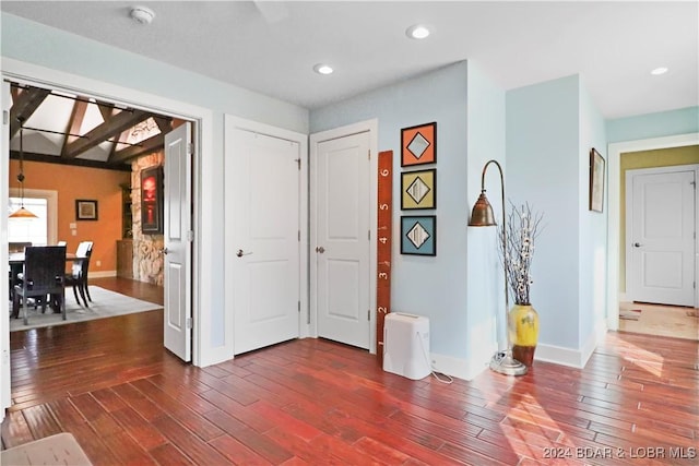 entryway with dark wood-type flooring