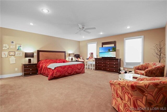 carpeted bedroom with ceiling fan