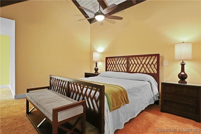 bedroom featuring ceiling fan, light colored carpet, and high vaulted ceiling