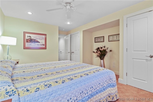 bedroom featuring light carpet and ceiling fan