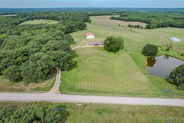 aerial view with a rural view and a water view