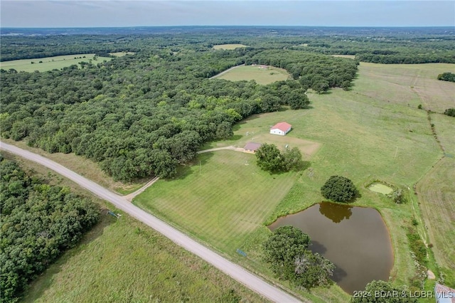 birds eye view of property with a water view and a rural view