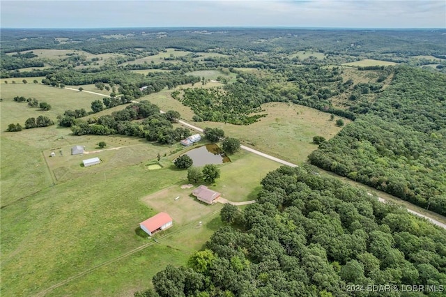 birds eye view of property featuring a rural view