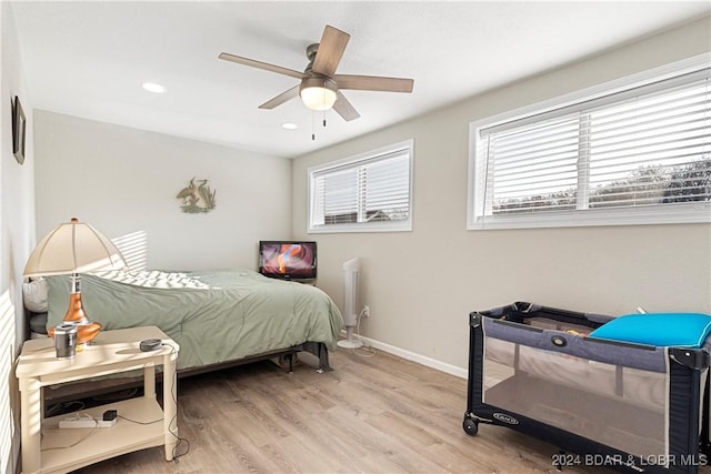 bedroom featuring ceiling fan and light hardwood / wood-style floors