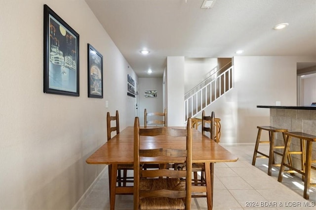 4800 Eagleview Dr Unit 241A, Osage Beach, MO 65065 - dining room with light tile patterned flooring, stairway, and recessed lighting