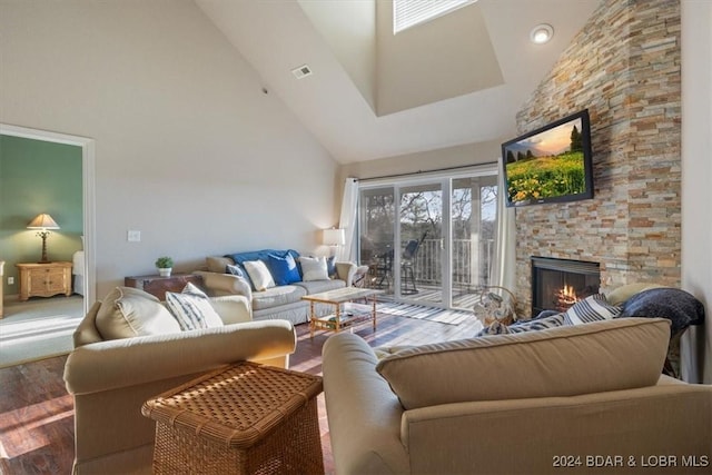 4800 Eagleview Dr Unit 241A, Osage Beach, MO 65065 - living room with high vaulted ceiling, a stone fireplace, and wood finished floors