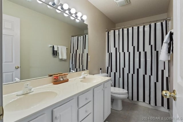 4800 Eagleview Dr Unit 241A, Osage Beach, MO 65065 - full bathroom featuring double vanity, tile patterned flooring, and a shower with shower curtain