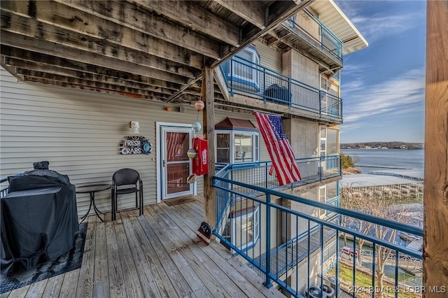 deck featuring a water view