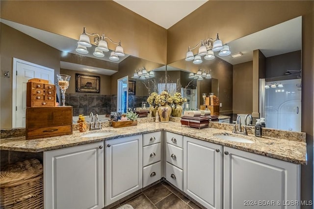 bathroom featuring tile patterned floors, vanity, and walk in shower