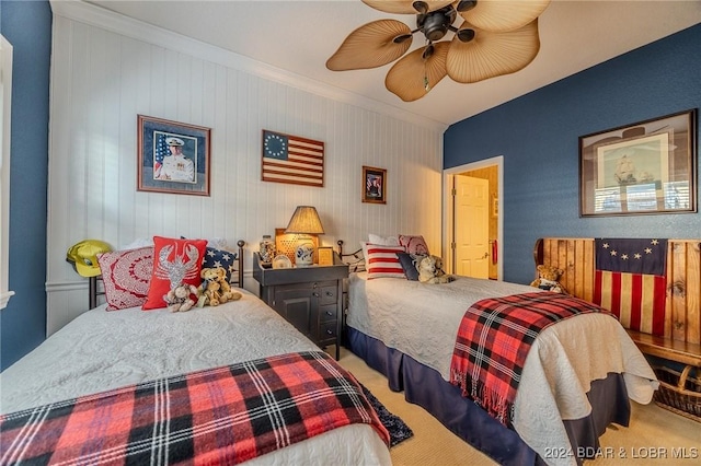 bedroom featuring carpet floors, ceiling fan, and crown molding