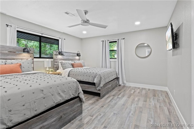 bedroom featuring ceiling fan and light hardwood / wood-style floors