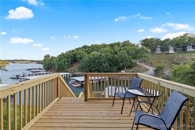 wooden terrace with a water view