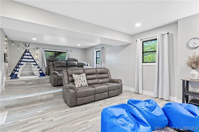 living room featuring light hardwood / wood-style flooring and plenty of natural light