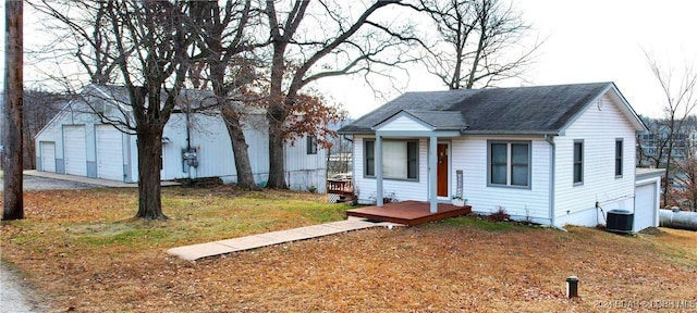 view of front of house featuring central AC unit and a garage