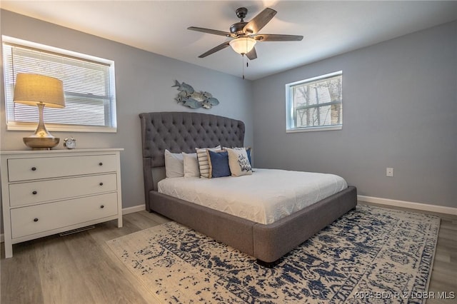 bedroom featuring ceiling fan and light hardwood / wood-style flooring