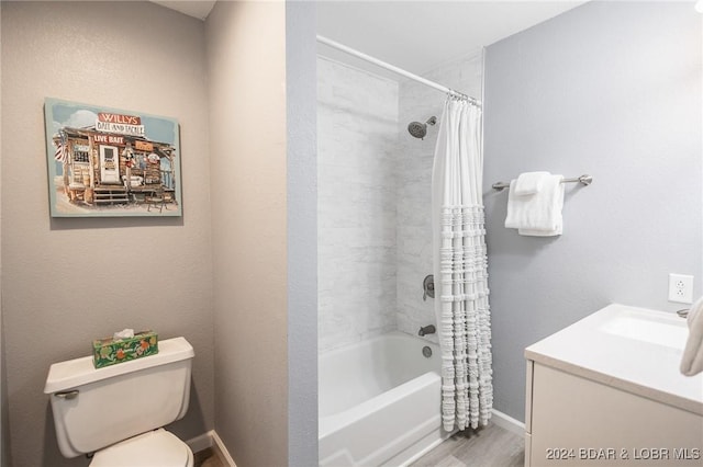 full bathroom with shower / tub combo with curtain, vanity, wood-type flooring, and toilet