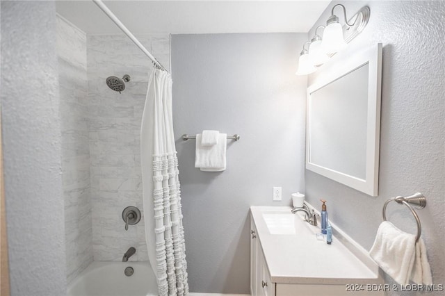 bathroom featuring shower / tub combo with curtain and vanity