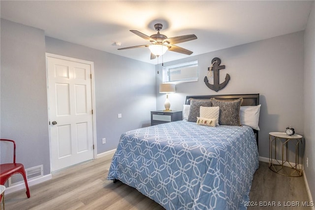 bedroom featuring ceiling fan and hardwood / wood-style floors