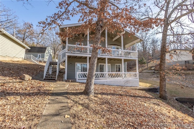 6455 Running Deer Dr, Osage Beach, MO 65065 - view of front of property featuring stairway and a deck