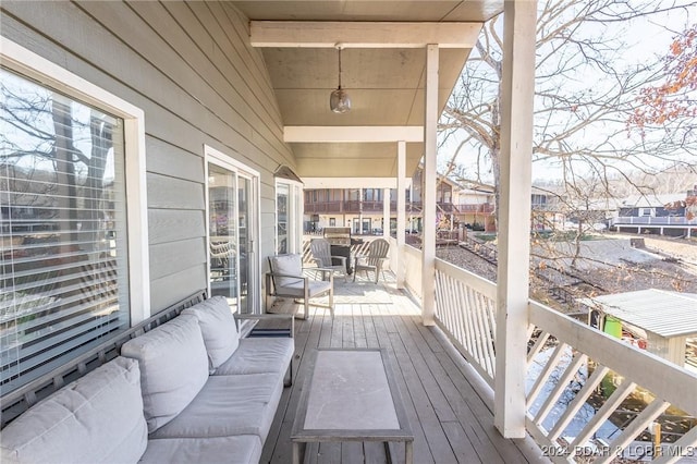 6455 Running Deer Dr, Osage Beach, MO 65065 - wooden deck featuring outdoor lounge area and a residential view