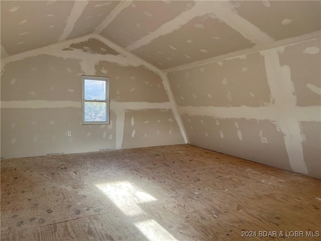 additional living space with lofted ceiling