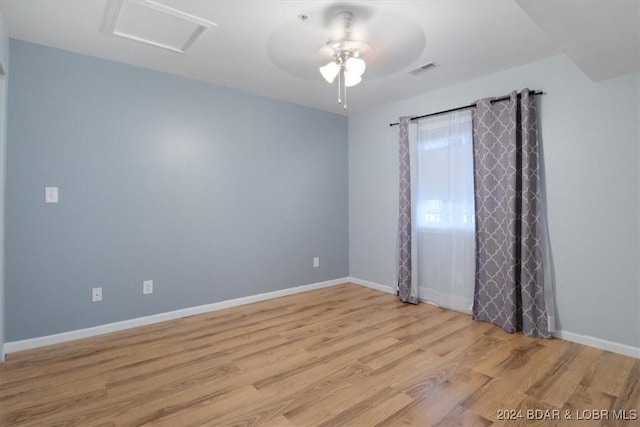 empty room featuring light hardwood / wood-style flooring and ceiling fan