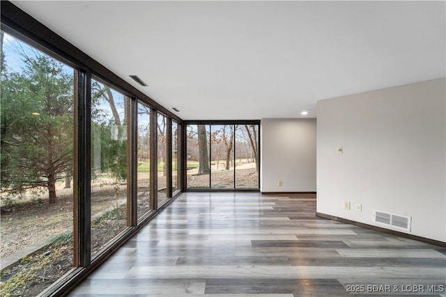 unfurnished sunroom with plenty of natural light