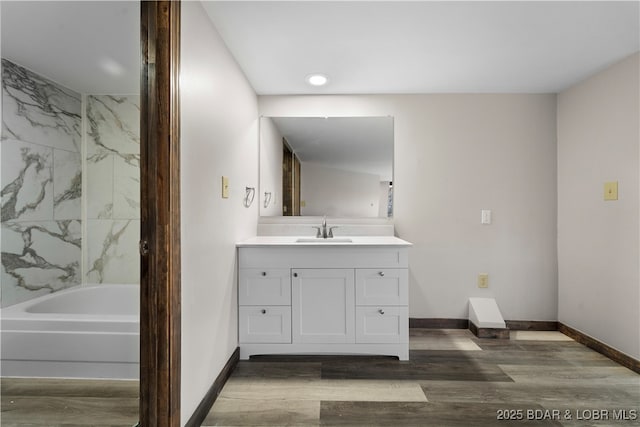 bathroom featuring vanity and hardwood / wood-style flooring