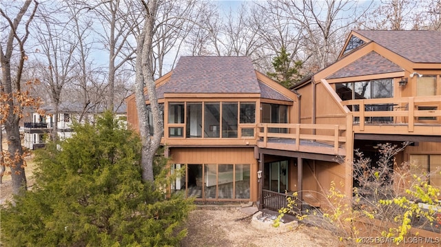 rear view of house with a sunroom