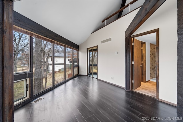 unfurnished sunroom featuring a water view and lofted ceiling