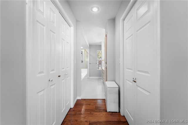 corridor featuring dark hardwood / wood-style floors