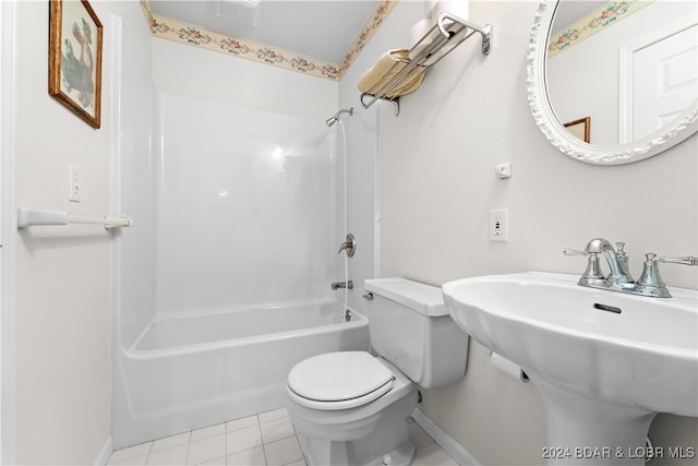 full bathroom with tile patterned flooring, sink, toilet, and shower / washtub combination