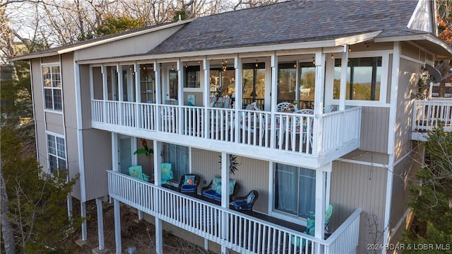 469 Staniel Cay Dr, Osage Beach, MO 65065 - back of property featuring a sunroom and a shingled roof