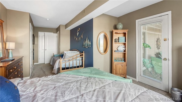 bedroom featuring access to outside, light carpet, and a closet