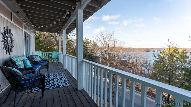 469 Staniel Cay Dr, Osage Beach, MO 65065 - wooden terrace with a water view and an outdoor living space