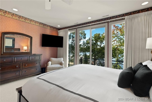 bedroom with carpet flooring, access to exterior, and ceiling fan